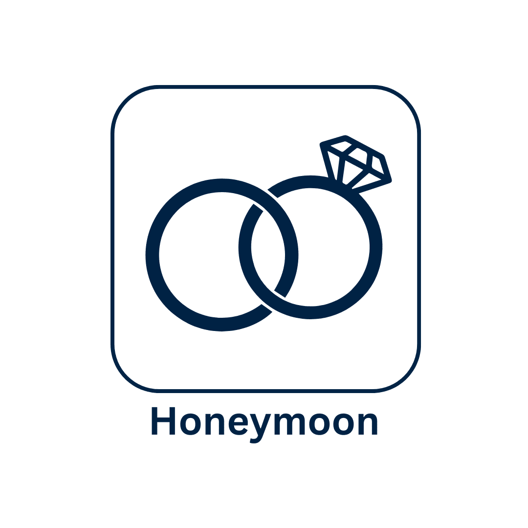 Honeymoon icon with overlapping wedding rings and diamond.