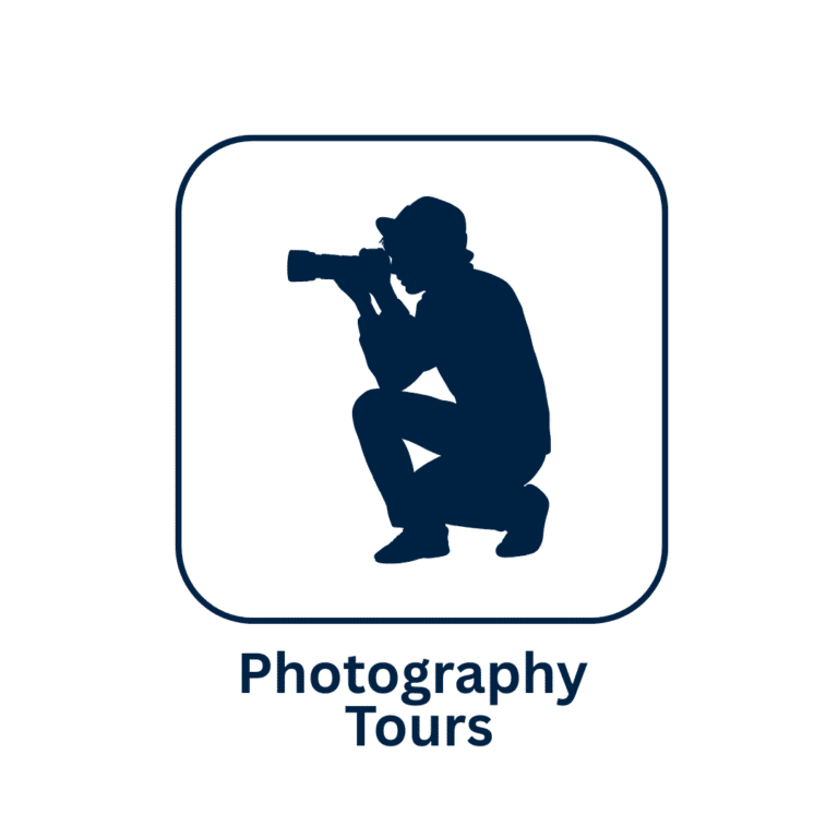 Photography tours logo featuring a crouching wildlife photographer with a telephoto camera.