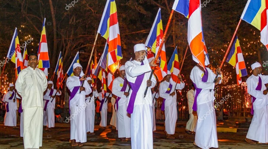 Kandy, Sri Lanka - August 11, 2005: people with flags of all parts of Sri Lanka take place at the night procession of the Pera Hera in Kandy, Sri Lanka.