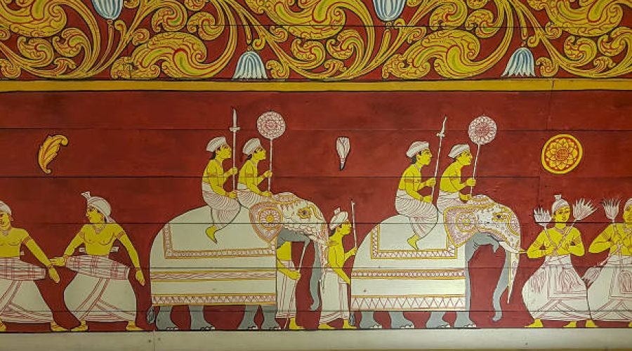 Sri Lanka - Kandy - Temple of the Tooth (Sri Dalada Maligawa) - A richly colored traditional mural on a red background depicts a royal elephant procession with riders, attendants and ceremonial parasols in gold and white. The painting reflects the Kandyan artistic tradition.